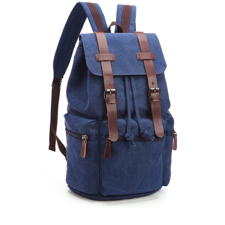 Sac à dos en toile bleu avec des sangles en cuir marron et plusieurs poches. Offre de cadeau d'entreprise spécial Noel